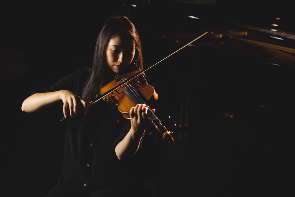 female student playing violin